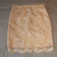 Romeo And Juliet Couture Champagne Colored Skirt With Gold Embroidered Embellishments, Zipper And Hook In Back, Size X-Small, Nwt Waist 12”, Length 17.5” (Laying Flat). Shell 100% Nylon, Lining And Embroidery Thread 100% Polyester. Hand Wash And Lay Flat To Dry. Skirt Hits Above The Knee For Me (I'm 5'). Spring Wedding Skirt With Sequins, Elegant Lace Mini Skirt With Lining, Elegant Gold Mini Skirt For Spring, Fitted Lace Skirt With Floral Embroidery, Fitted Pencil Skirt For Wedding, Elegant Floral Embroidered Party Skirt, Lace Party Skirt With Lining, Floral Embroidered Fitted Mini Skirt, Lace Lined Skirt For Party