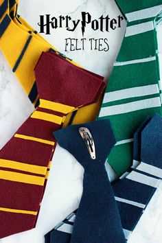 several harry potter ties laid out on a marble table with the words, felt ties