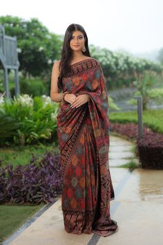 Black Kani saree is crafted in silk fabric and is accentuated all over with Kani Jamawar weaving  in traditional motifs like paisleys and flowers in gorgeous colours. A touch of zari is woven into the threads to add a hint of shine and to the royalty of this gorgeous saree. It comes with a blouse piece in same colour that has Kani weaving in booti pattern.  The design inspiration for this Pashmina Silk saree is drawn from the heritage weaves of ancient Pashmina shawls from Kashmir that date back Luxury Tussar Silk Shawl In Bollywood Style, Luxury Pashmina Traditional Wear For Ceremonies, Elegant Semi-stitched Multicolor Pre-draped Saree, Bollywood Style Festive Pre-draped Saree With Kalamkari Print, Navratri Meenakari Tussar Silk Pre-draped Saree, Navratri Katan Silk Pre-draped Saree With Meenakari, Bollywood Style Jamawar Pre-draped Saree For Diwali, Multicolor Tussar Silk Pre-draped Saree For Eid, Bollywood Style Multicolor Banarasi Silk Pre-draped Saree