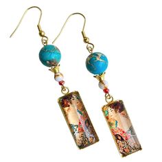 Enjoy Gustav Klimt's Renowned Artwork, "Lady With Fan" As Earrings Set In A Gold Tone Stainless Steel Tray And Preserved Under A Glass Cabochon. Pretty Teal Sea Sediment Stones And Red Glass Bead Match The Artwork's Interplay Of Colors. - Made Of A Gold Tone Stainless Steel, Small Stone Beads, And Teal Sea Sediment Stone Beads - Original Artist-Designed Fig + Lulu Composition - Elegant Packaging Make Gift-Giving Easy Materials Sea Sediment Stones, Gold Tone Stainless Steel Cabochon Tray & Zinc A Blue Spiritual Earrings For Gifts, Handmade Blue Spiritual Earrings, Blue Handmade Spiritual Earrings, Blue Bohemian Earrings With Artistic Design, Bohemian Blue Earrings With Artistic Design, Artistic Turquoise Earrings For Gift, Blue Artistic Design Earrings For Gift, Oversized Hoop Earrings, Shiny Earrings