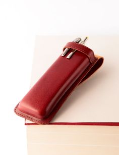 "Fountain pen case for men. Vintage pen case. Pencil case. SPECIFICATIONS: The case measures approximately: - Length: .17cm (6,8\") - Width: 5,5cm (2,2\") - Height: 1,6cm (1,1\") (Pens are not included.) This finely crafted leather pen case is a sophisticated & functional accessory to carry your favorite pens. Handmade with natural vegetable tanned leather. This case is wet-formed to precisely fit desired shape. The leather, once wet formed and dried, becomes very stiff providing an extra me Classic Rectangular Pencil Case For Daily Use, Leather Cases With Pen Slots For Daily Use, Red Pencil Case With Pen Holders, Portable Red Pencil Case As Gift, Rectangular Stationery With Pen Slots For Everyday Use, Red Pencil Case With Pen Holders For Everyday, Red Rectangular Pencil Case With Pen Holders, Classic Cases With Pen Slots, Classic Pencil Case With Pen Slots