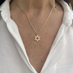 "The Gold Star of David Necklace is a stunning piece of jewelry that symbolizes Jewish heritage and faith. Crafted in radiant gold, this necklace features the iconic Star of David charm, representing unity, protection, and an eternal connection with God. It serves as a meaningful gift and a cherished symbol of love and support for those celebrating Jewish culture. ❤ 𝗠𝗘𝗔𝗦𝗨𝗥𝗘𝗠𝗘𝗡𝗧𝗦 ❤ Pendant width: 0.47\"/ 1.2 cm. Pendant length: 0.47\"/ 1.2  cm. Made of high-quality 24k gold plated brass Please choose your length from the drop-down list. ❤ 𝗠𝗬 𝗦𝗧𝗢𝗥𝗘 ❤ For more Judaica pendant necklaces: http://bit.ly/3UBSknF Back to my shop:  https://etsy.me/2ZBJCus ❤ 𝗔𝗕𝗢𝗨𝗧 𝗠𝗬 𝗟𝗜𝗧𝗧𝗟𝗘 𝗦𝗧𝗢𝗥𝗘 ❤ *This jewelry was made solely by me.* *If you have any questions or requests do no Jewish Star Of David Tattoo, Star Of David Necklace Aesthetic, Star Of David Bracelet, Star Of David Jewelry, Gold Star Of David Necklace, Siblings Bedroom, Judaism Aesthetic, Magen David Necklace, Jewish Star Necklace