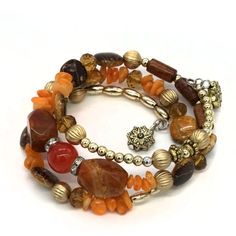 Memory Wire, Bangle Style. 3 Strands. 2 Charms. Amber Colored Beads. Fast Shipping. Free Gift With Purchase. Mybeademporium.Com B 544 Orange Faceted Beads Jewelry, Adjustable Orange Beaded Spiritual Bracelet, Adjustable Orange Spiritual Beaded Bracelet, Spiritual Orange Adjustable Beaded Bracelets, Handmade Orange Spiritual Bracelets, Orange Spiritual Beaded Bracelets, Orange Multi-strand Jewelry For The Beach, Orange Multi-strand Jewelry For Beach, Orange Multi-strand Hand-strung Jewelry