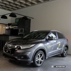 the new honda hr - v is parked in an empty garage