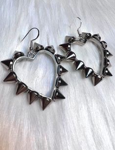 These awesome spiked earrings are part of our new Valentine's Day Collection. It's packed full of beautiful pieces.  These are  Silver hearts with shiny spikes all the way around on small silver hooks. Big Funky Earrings, Trendy Metal Heart Earrings For Party, Silver Punk Jewelry For Valentine's Day, Punk Silver Jewelry For Valentine's Day, Valentine's Day Punk Silver Jewelry, Gothic Metal Earrings For Valentine's Day, Nickel-free Punk Earrings, Silver Heart-shaped Punk Jewelry, Silver Punk Hoop Earrings For Party