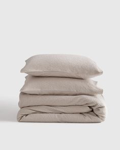 three pillows stacked on top of each other