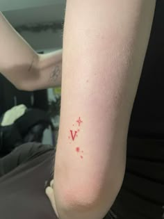 red v tattoo w fine line stars Red Stars Tattoo, Red Ink Fine Line Tattoo, V Tattoo Ideas, Fine Line Stars, Fine Line Red Tattoo, Red Lines Tattoo, Small Red Ink Tattoo, Red Fine Line Tattoo, Red Star Tattoo