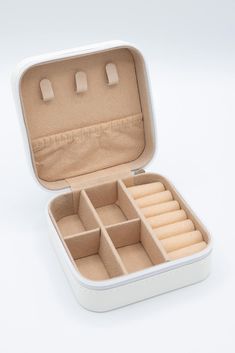 an open white box with compartments and dividers