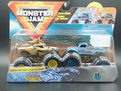 two monster jam trucks are in the packaging