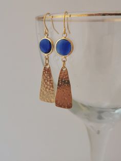 Blue and gold earrings. Hammered gold earrings with faceted blue glass. Gold and pink earrings. Gold plated, nickel free and hypoallergenic.Royal blue gold earrings. Blue Hammered Jewelry As Gift, Blue Hammered Jewelry As A Gift, Blue Hammered Jewelry For Gift, Blue Nickel Free Gold Plated Earrings, Faceted Metal Earrings, Blue 14k Gold Filled Jewelry With Ear Wire, Hypoallergenic Gold Plated Blue Jewelry, Nickel Free Blue Gold Plated Earrings, Blue Hammered Earrings For Gift