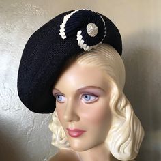 This Is A Truly Stunning 1940s' Navy Beret Made Of Very Fine Straw. The Look Is Completed By A Creatively Intricate Trim Made Of Folded Navy And White Grosgrain Bands. The Shape Of The Trim Is Like A Beautifully Curved Seashell. This Trim Adorns One Side Of The Beret, Which Is To Be Worn In An Asymmetrical Way, As Pictured. The Wartime 40’s Saw A Huge Variety Of Hats That Were Suitable For Any Face Shape, Hairstyle Or Personal Preference. Throughout The War And On Both Sides Of The Atlantic, Elaborate Creations Brightened Dreary Utility Fashions, Brought About By Rationing. The Only Items Not Rationed Were Hat Materials. Label: No Designed Label, Indicating It To Be A Custom Creation. 1940s Hairstyles, Trim Color, The Atlantic, Face Shape, Hats Vintage, Navy White, Custom Creations, Face Shapes, Navy And White