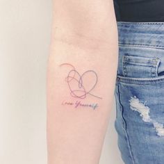 a woman's arm with a tattoo that says love yourself on the left side of her arm