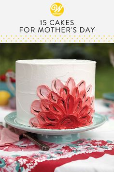 a white cake with red flowers on it and the words 15 cakes for mother's day