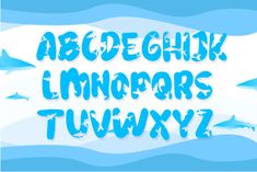 an upper and lower case of the alphabet with dolphins swimming in the ocean behind it