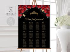 a black and red wedding seating chart with roses