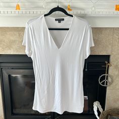 White, Inc Deep V Neck Tee Shirt! Longer Length (Approx 27 1/2” From Shoulder To Hem). The Deeper V Neck Is Very Flattering! White Stretch V-neck Shirt, Basic V-neck Summer Shirt, Studded Shorts, Black Lace Shorts, Sequin Tee, Womens Black Shorts, Long Tee, Grey Tie Dye, Boat Neck Tops