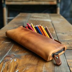 Imprint your signature style on your desk with our refined utility leather pencil cases, showcasing your taste for craftsmanship and order. Leather Pencil Case With Pen Slots For School, Brown Pencil-shaped Case For Personal Use, Everyday Pencil Case With Pen Slots, Classic Rectangular Pencil Case For Personal Use, Modern Pencil Shaped Pencil Case For Everyday Use, Modern Everyday Pencil-shaped Pencil Case, Pencil Case With Pen Holders For Organization, Modern Rectangular Pencil Case With Pen Holders, Everyday Brown Pencil Case With Pen Holders