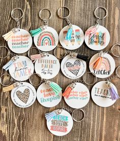 a collection of key chains with different sayings on them, including one for each member