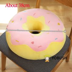 a donut shaped pillow sitting on top of a chair