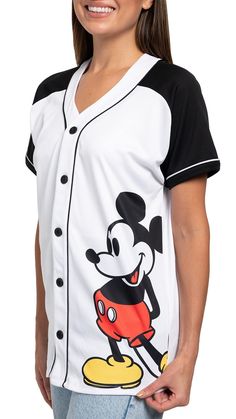 a woman wearing a mickey mouse baseball jersey