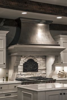 a kitchen with an oven, stove and counter tops in it's center island