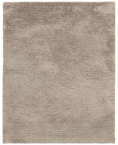 a beige rug on a white background with no one in the room to see it