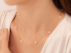 "14k Gold Pearl Necklace, Dainty Pearl Necklace, Dainty Freshwater Pearl Necklace, Bridesmaid Gifts, Pearl Jewelry, Gold Pearl Necklace * Material: High Quality 925 Sterling Silver, 14k Solid Gold, 8K Solid Gold ( you can choice it on material menu) H O W ∙ T O ∙ O R D E R - Select options from the drop-down menu - Add to cart and proceed to checkout The silver pearl necklace in the photo is the one that you will be purchasing.  Necklace will be shipped in an elegant gift box for no extra charge. C A R E ∙ I N S T R U C T I O N S Although our jewelry are high quality with extra layers of coat for long lasting, yet plated jewelry should be cleaned periodically. To extend the life of your jewelry, it's very important that you keep it dry (never bathe or spray perfume on your jewelry, chemica Anniversary Pearl Chain Necklace, Dainty Single Strand Jewelry For Anniversary, Delicate Single Strand Jewelry For Anniversary, Delicate Single Strand Necklaces For Formal Occasions, Yellow Gold Single Strand Necklace For Wedding, Delicate Single Strand Necklace For Formal Occasions, Single Strand Jewelry For Anniversary, Delicate Single Strand Necklace For Anniversary, Fine Jewelry Pearl Necklace With Delicate Chain