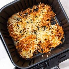 shredded carrots in a black plastic container