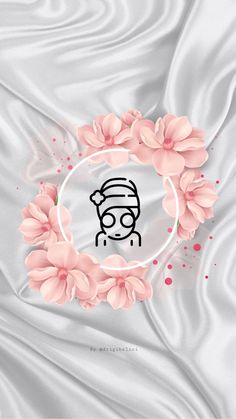 a white satin background with pink flowers and a person's face in the center