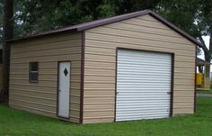 two garages with one door open and the other closed on grass in front of trees