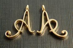 🧡 Finished product shop: https://www.etsy.com/shop/BlissKorea?ref=shop_sugg 💚 Raw(non-plated) product shop: https://www.etsy.com/shop/JewelryMaterialKorea?ele=shop_open Shape: Capital letter A with link Material: 16K gold plated brass Size: 19x17mm, 3mm thick Quantity: 2 pcs ** Please kindly note that the plating color, shape and size slightly different per batch. ** For these letters in gold: https://www.etsy.com/shop/JewelryKorea?ref=seller-platform-mcnav&search_query=16k%2C+G8+series ** Gold Initial Pendant Charms For Anniversary, Personalized Gold Charms With Initials, Gold Anniversary Charms With Initial Pendant, Gold Initials Charms For Personalized Gift, Gold Charms With Initials For Personalized Gift, Gold Initials Pendant Charm, Gold Pendant Charms With Initials, Gold Letter Pendants, Alphabet Charm