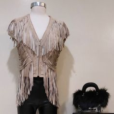 Rare Find! An Absolutely Spectacular, One-Of-A-Kind Statement Vest From Bebe. It's One Of Those Hot Timeless Pieces That Will Look Amazing With Any Outfit. Comes In Gorgeous Go-With-Everything Taupe ( Cement). Crafted From High-Quality 100% Genuine Leather (Suede). Designed With A Fitted Silhouette, Stunning Draped Cascading Fringe For A Bohemian-Chic Finish, Front Zip Closure, And Smooth Soft Lining. Very Well Made And Tailored. Approx Measurements: Pit To Pit 18.5", Waist 15.25", Front Length Chic Fitted Outerwear For Festivals, Chic Fitted Festival Outerwear, Fitted Beige Outerwear For Festivals, Armor Fashion, Cement Color, Fringe Vest, Fitted Silhouette, Bohemian Chic, Timeless Pieces