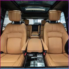 the interior of a vehicle with tan leather seats