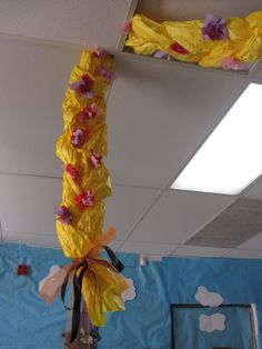 some paper flowers are hanging from the ceiling