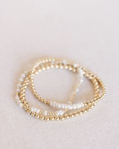 handcrafted stretch bracelet made with 14k gold filled 3mm beads made by artists in the USA Length - 6.5 inches Gold Pearl Single Strand Beaded Bracelets, Dainty Pearl Stretch Bracelet With Round Beads, Dainty Pearl Beaded Bracelets With Spacer Beads, Dainty Pearl Beaded Bracelet With Spacer Beads, Dainty Gold Stretch Bracelet With Gold Beads, Dainty Gold Bead Stretch Bracelet, Dainty 14k Gold-filled Stretch Bracelet With Gold Beads, Dainty Stackable Pearl Beaded Bracelets, Dainty Pearl Stackable Beaded Bracelets