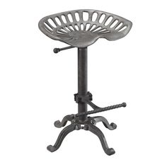 a metal stool with an iron base and foot rest on it's back legs