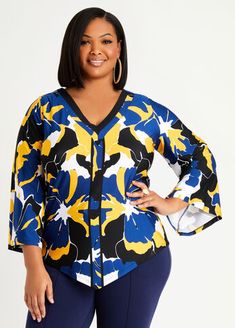 This abstract print plus size top is cut and draped in a flowing silhouette with an asymmetric hem and flare sleeves. Plus Size Dressy, Flare Long Sleeve, Statement Sleeves, Flare Sleeves, Ashley Stewart, Work Tops, Asymmetrical Tops, Plus Size Top, Knit Tees