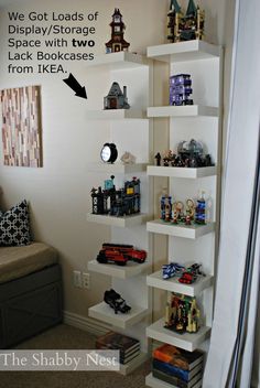 the shelves in this room are filled with toy cars and other things to play with