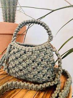 This purse is handmade with 4mm macrame cord, features a hand strap and a detachable shoulder strap. Width: 7 in Height: 9 in length of shoulder strap: 49 in Includes 6 in x 8 in removable drawstring muslin bag Macrame Clutch, Macrame Purse, Muslin Bags, Macrame Bag, Hand Strap, Handmade Macrame, Macrame Cord, Purse Strap, Purses And Handbags