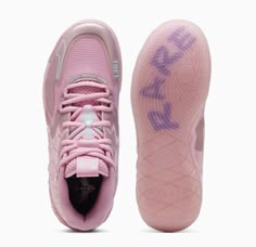 a pair of pink shoes with purple writing on the side and white soles in front