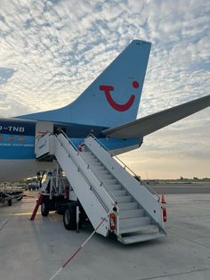 an airplane with stairs leading up to it