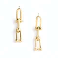 The high polish 14K gold plated finish on our effortlessly cool U Link Chain Earrings will add just the right amount of drama to your outfit throughout the day. Available for Limited Time Only Each purchase supports rehabilitation of women affected by human trafficking. Materials: 14k gold plated stainless steel with 14K gold plated earrings. Hypoallergenic; lead and cadmium free with nickel content less than 100 ppm.Size: 1.6 inches Chic Gold Earrings For Workwear, Chic Gold Earrings For Work, Yellow Gold Chain Brass Earrings, Trendy Gold Earrings For Work, Gold-tone Drop Earrings With Adjustable Chain, Modern Gold Chain Earrings For Everyday, Trendy Gold Linear Earrings For Everyday, Gold-tone Drop Earrings With Gold Chain, Modern Gold Chain Drop Earrings