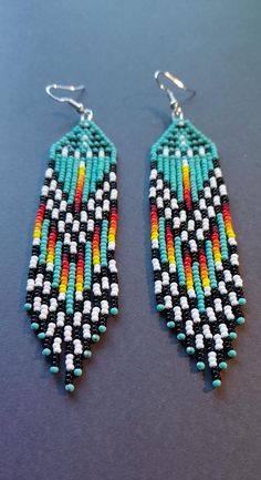 Large pair of Native style beaded earrings. Southwestern Fringe Earrings With Round Beads, Traditional Beaded Earrings With Fringe And Round Beads, Traditional Fringe Beaded Earrings With Round Beads, Traditional Fringed Beaded Earrings, Southwestern Fringe Jewelry With Round Beads, Turquoise Fringe Earrings With Round Beads, Turquoise Earrings With Fringe And Round Beads, Native Crafts, Beaded Fringe Earrings