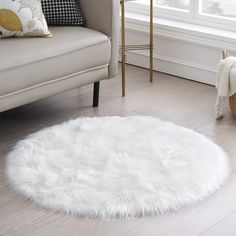 a living room with a white rug on the floor