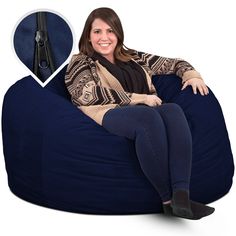 a woman sitting on a bean bag chair with zippered jacket and black booties