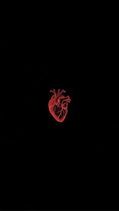 a red heart on a black background