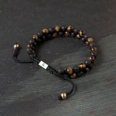 Sanatio Double Row Tiger’s Eye and Lava Rock Bracelet | In stock! | Arkai Lava Stone Bracelet Men, Lava Rock Bracelet For Men, Spiritual Black Beads Lava Stone Bracelet, Men Jewellery, Adjustable Hand-strung Lava Stone Bracelet, Double Bracelet, Black Lava Stone Beaded Bracelets, Hand-strung, Lava Rock Bracelet, Lava Rock