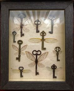 a shadow box filled with lots of keys