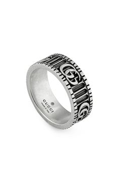 An ode to an archival version of the house's emblem, this sterling silver ring features gorgeous signature etching Style Name:Gucci Gg Band Ring. Style Number: 5757402. Available in stores. Gucci Ring, Expensive Rings, Mens Band Rings, Titanium Jewelry, Gucci Gg Marmont, Girl Things, Gg Marmont, Mens Silver Rings, Mens Band