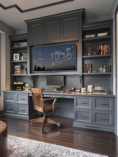 a home office with built - in desk and bookcases